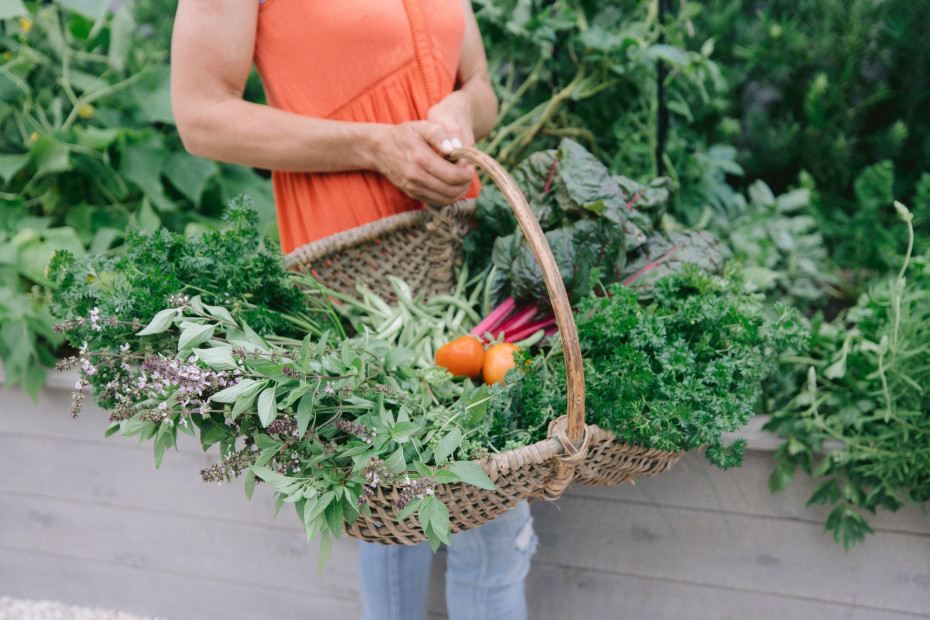 5 ways to make money as a gardener - Nicole Burke with harvest basket